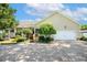 A residence with an attached garage and a well-manicured lawn, all on a sunny day at 86 Basswood Cir, Willow Springs, NC 27592