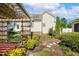 Charming garden with a pergola and lush landscaping at 86 Basswood Cir, Willow Springs, NC 27592