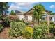 Beautiful garden with a pergola and lush greenery surrounding the property at 86 Basswood Cir, Willow Springs, NC 27592
