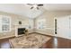 Inviting living room featuring hardwood floors, fireplace, and a bright, airy atmosphere at 86 Basswood Cir, Willow Springs, NC 27592