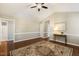 Open living area featuring hardwood floors, neutral paint, and natural light, offering versatile living space at 86 Basswood Cir, Willow Springs, NC 27592