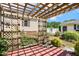 Inviting outdoor space with a pergola and brick patio, perfect for relaxation at 86 Basswood Cir, Willow Springs, NC 27592
