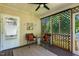 Cozy screened-in porch featuring comfortable seating and charming decor at 86 Basswood Cir, Willow Springs, NC 27592