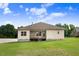 Expansive backyard featuring a well-maintained lawn and covered back porch at 88 Longo Ln, Benson, NC 27504