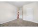 Bedroom with carpet and multiple doors at 88 Longo Ln, Benson, NC 27504
