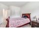 Cozy bedroom with carpet, with single bed, nightstand, and multiple doors at 88 Longo Ln, Benson, NC 27504