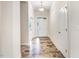 Bright foyer with wood-look floors and white trim throughout the hallway at 88 Longo Ln, Benson, NC 27504