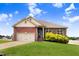 Lovely one-story red brick house with a manicured lawn and a two-car garage at 88 Longo Ln, Benson, NC 27504