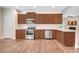 Spacious kitchen featuring stainless steel appliances and sleek countertops at 88 Longo Ln, Benson, NC 27504
