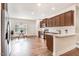 Kitchen with dark cabinets, stainless appliances and an eat-in area with bright windows at 88 Longo Ln, Benson, NC 27504