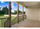 Relaxing covered porch featuring wood flooring and a view of the neighborhood at 88 Longo Ln, Benson, NC 27504