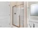 Glass enclosed shower with a window next to it at 88 Longo Ln, Benson, NC 27504