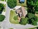Home featuring lush greenery, a well-maintained lawn, and a circular driveway at 917 Haddon Hall Dr, Apex, NC 27502