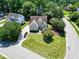 Beautiful home with manicured front yard, lush trees, and a convenient circular driveway at 917 Haddon Hall Dr, Apex, NC 27502