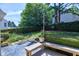Backyard featuring a wooden bench, patio and lush greenery, perfect for outdoor relaxation at 917 Haddon Hall Dr, Apex, NC 27502