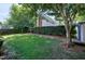 Spacious backyard featuring lush landscaping, mature trees and a well-maintained lawn at 917 Haddon Hall Dr, Apex, NC 27502