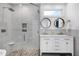Lovely bathroom featuring white cabinets, double sinks, and a modern glass-enclosed shower at 917 Haddon Hall Dr, Apex, NC 27502