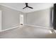 View of bedroom featuring neutral colored carpet and walls with a doorway leading to a bathroom at 917 Haddon Hall Dr, Apex, NC 27502