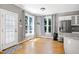 Bright breakfast nook featuring backyard views and convenient access to both the kitchen and door to the outside at 917 Haddon Hall Dr, Apex, NC 27502