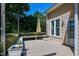 Cozy deck area featuring a bench, patio umbrella, and access to the home's interior at 917 Haddon Hall Dr, Apex, NC 27502