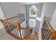 A grand two-story foyer with hardwood floors and staircase at 917 Haddon Hall Dr, Apex, NC 27502