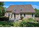The exterior showcases a well-maintained yard, a tiled patio and several windows at 917 Haddon Hall Dr, Apex, NC 27502