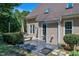Exterior of the home featuring a patio, well-maintained yard, and beautiful landscaping at 917 Haddon Hall Dr, Apex, NC 27502