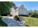 Charming home featuring landscaped front yard, driveway, and a welcoming entrance at 917 Haddon Hall Dr, Apex, NC 27502