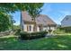 The exterior shows a spacious yard, tiled patio area, skylights and well-maintained landscaping at 917 Haddon Hall Dr, Apex, NC 27502