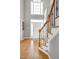 Beautiful entryway with white door, detailed trim, and hardwood flooring at 917 Haddon Hall Dr, Apex, NC 27502