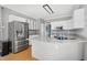 Modern kitchen with stainless steel appliances, granite countertops, and white cabinetry at 917 Haddon Hall Dr, Apex, NC 27502