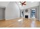 Bright living room with vaulted ceiling, fireplace, wood floors and plenty of natural light at 917 Haddon Hall Dr, Apex, NC 27502