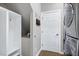 Functional mudroom with custom storage, door to the outside, and modern appliances at 917 Haddon Hall Dr, Apex, NC 27502
