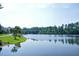 Scenic view of the pond with reflections of the trees and sky on a bright day at 917 Haddon Hall Dr, Apex, NC 27502