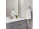 Stylish powder room with a gray vanity, marble countertop, and modern fixtures at 917 Haddon Hall Dr, Apex, NC 27502