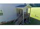 Detailed view of the home's back porch featuring wooden steps and a covered area at 933 Weatherby Ln, Creedmoor, NC 27522