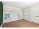 bedroom with jungle wall decals and neutral carpet at 933 Weatherby Ln, Creedmoor, NC 27522