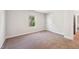 Neutral bedroom featuring carpet, white trim, and a window at 933 Weatherby Ln, Creedmoor, NC 27522