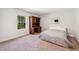 Spare bedroom featuring carpet, desk, and nature views from the window at 933 Weatherby Ln, Creedmoor, NC 27522