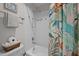 Bathroom featuring a bathtub with shower, a tiled wall, and a tropical curtain at 100 Redfoot Run Rd, Chapel Hill, NC 27516
