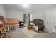 Cozy bedroom featuring a play tent, a crib, and a large window that provides natural light at 100 Redfoot Run Rd, Chapel Hill, NC 27516