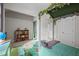 Bright bedroom featuring leafy canopy bed, bookshelf with toys, and play area at 100 Redfoot Run Rd, Chapel Hill, NC 27516