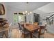 Dining room with a large wooden table, chairs, and stylish chandelier at 100 Redfoot Run Rd, Chapel Hill, NC 27516