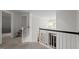 Upstairs hall with hardwood floors and natural light at 100 Redfoot Run Rd, Chapel Hill, NC 27516