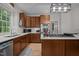 Updated kitchen with stainless steel appliances, ample counter space, and custom cabinetry at 100 Redfoot Run Rd, Chapel Hill, NC 27516