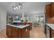Contemporary kitchen featuring a center island, stainless steel appliances, and hardwood flooring at 100 Redfoot Run Rd, Chapel Hill, NC 27516