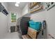 Functional laundry room with modern washer and dryer, storage cabinets, and ample workspace at 100 Redfoot Run Rd, Chapel Hill, NC 27516