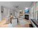 Spacious living room with fireplace, built-in shelves, large rug, and comfortable seating arrangement at 100 Redfoot Run Rd, Chapel Hill, NC 27516