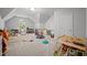 Spacious playroom with a variety of toys, games, and natural light from a large window at 100 Redfoot Run Rd, Chapel Hill, NC 27516