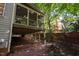 View from under the home's porch, showing its supports and screens at 100 Redfoot Run Rd, Chapel Hill, NC 27516